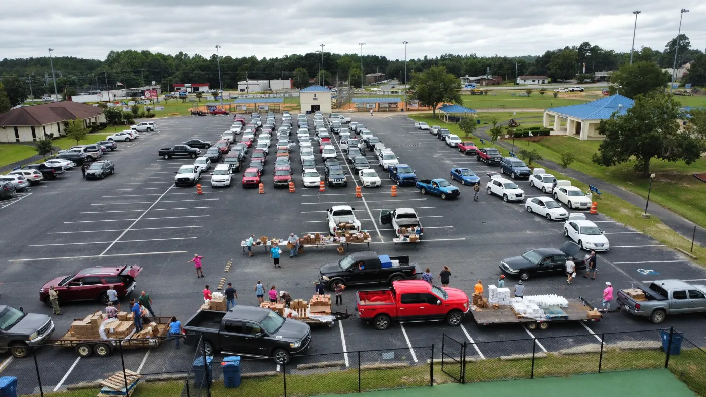 Aerial view of cars lined up at a drive-thru food distribution